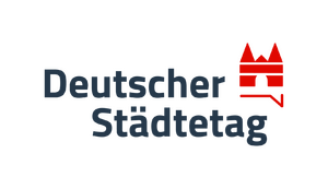 Text und Grafik Logo "Deutscher Städtetag" Die Grafik ist ein stiliertes Stadttor im Kreis